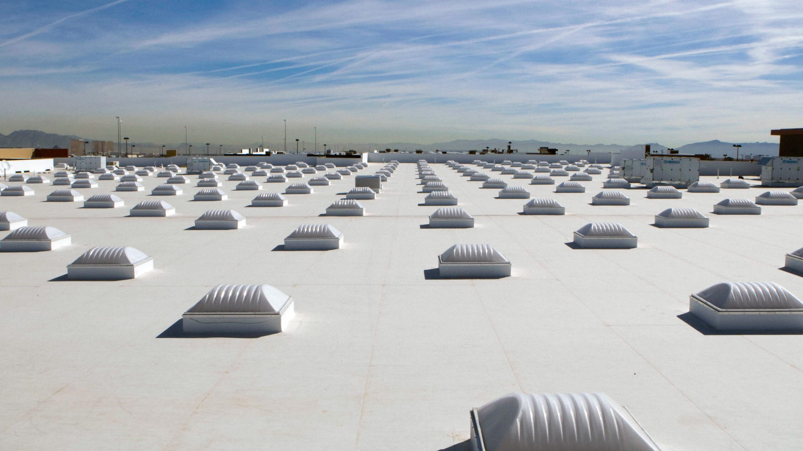 Commercial Roof Coatings — Silicone and SPF/Silicone Hybrid Systems commercial roof planning in New Orleans