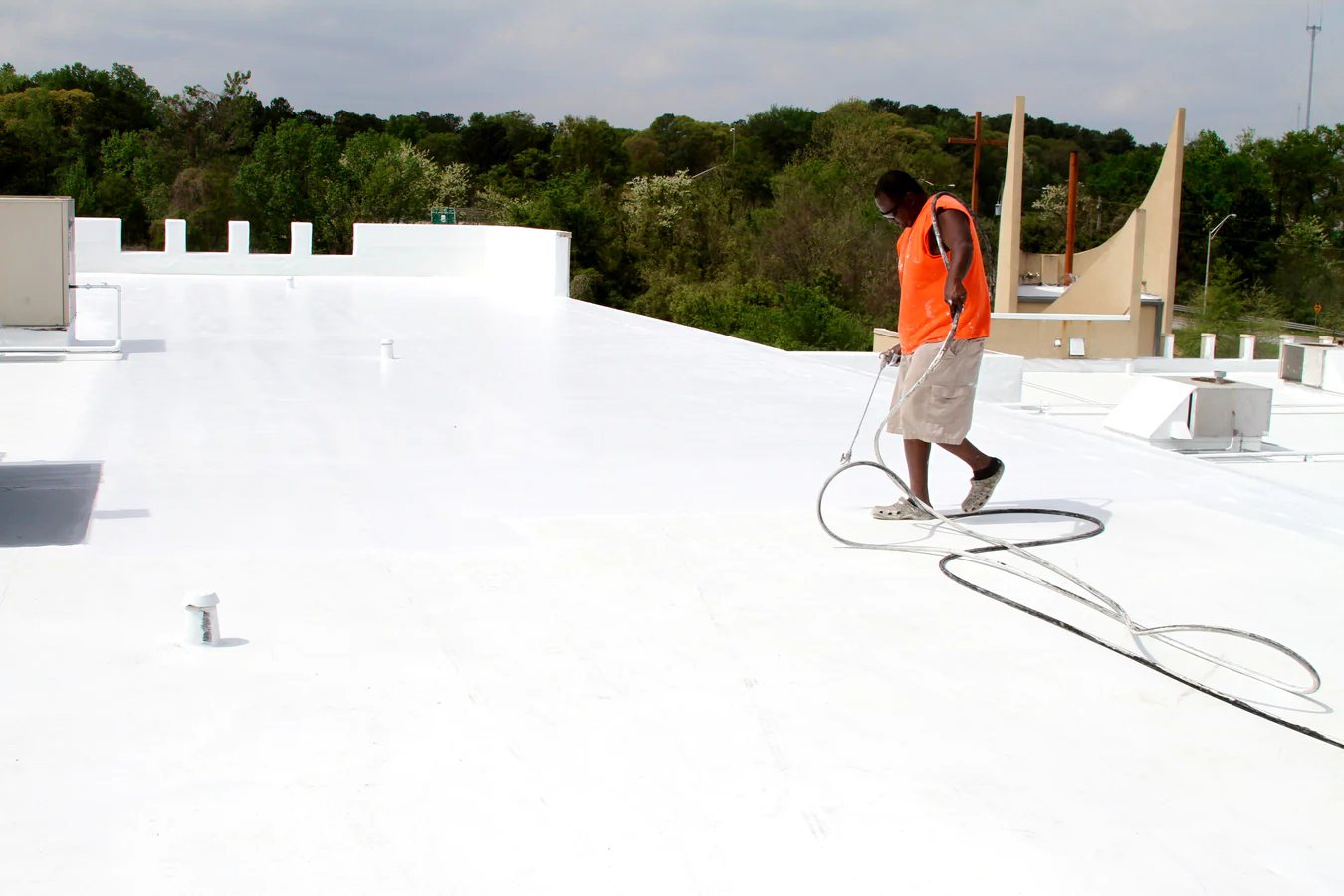 Silicone Roof Coating — Fluid-Applied Restoration commercial roof planning in New Orleans